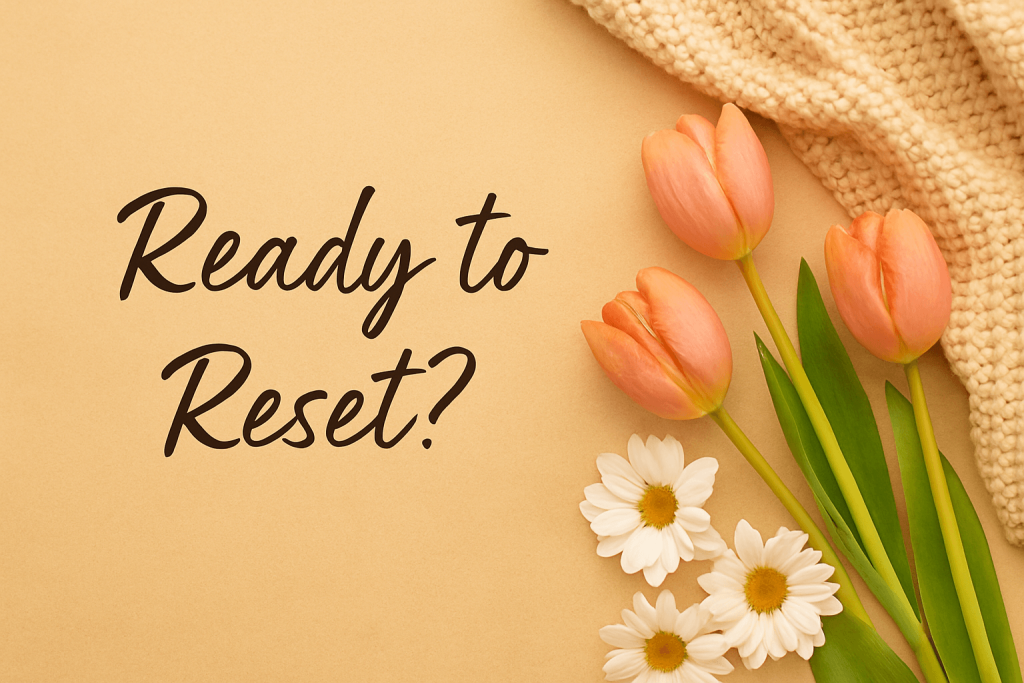 A soft beige background with orange tulips, white daisies, and a cozy knit blanket arranged beside the text “Ready to Reset?”