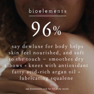 Close-up of a woman’s shoulder and arm with text overlay: '96% say Dewluxe for Body helps skin feel nourished and soft to the touch, smoothing dry elbows and knees with antioxidant-rich oils.'