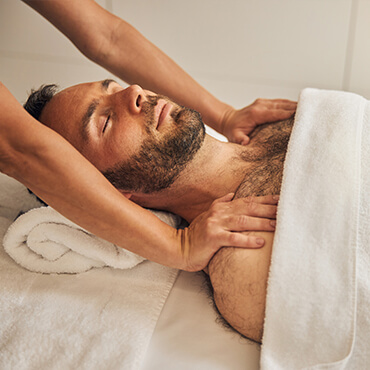 Man getting a massage for headaches